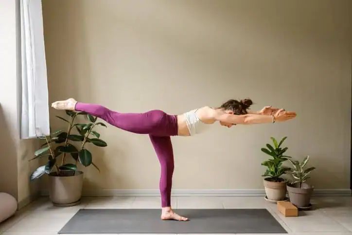 Achieving the Perfect Tone: How Often Should You Exercise for Results? 1 Woman doing Yoga exercise Lutterworth to help with toning the body.