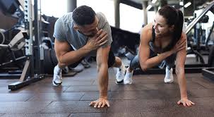 Sculpting Sleek Arms: The Essential Role of Cardio in Toning Without Bulking Up 1 Image of man and woman doing Cardio Lutterworth to tone their arms.